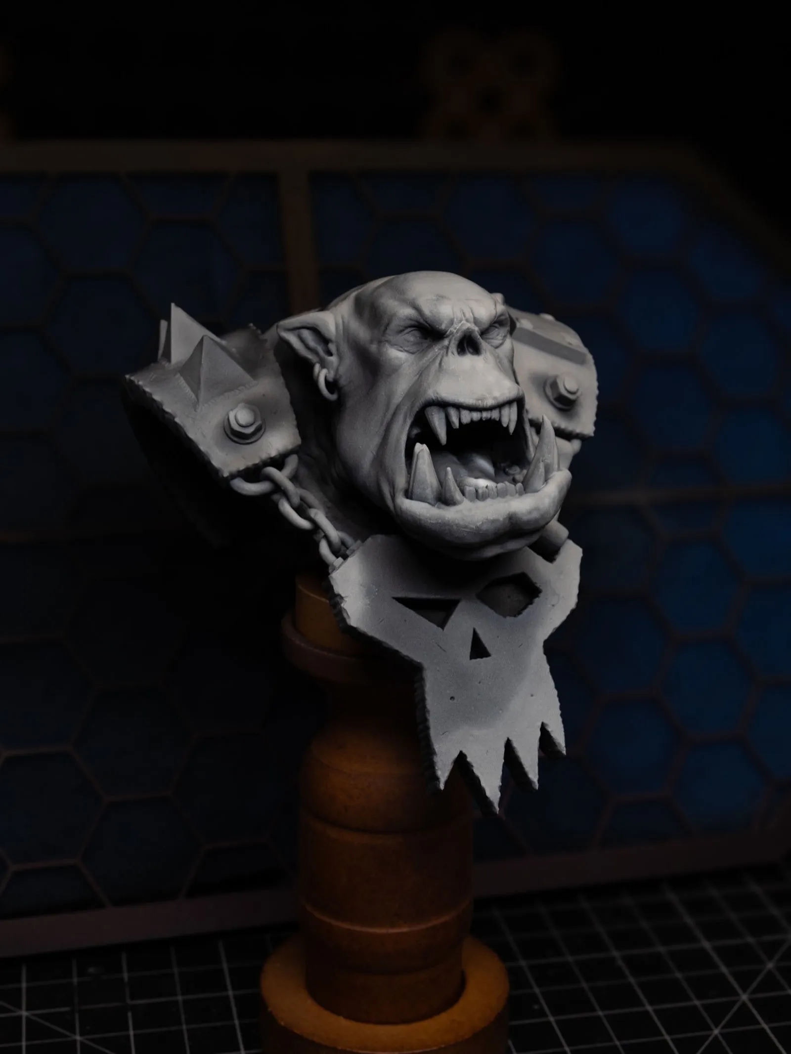 Ork bust with zenithal values applied, high contrast highlights on brow and nose