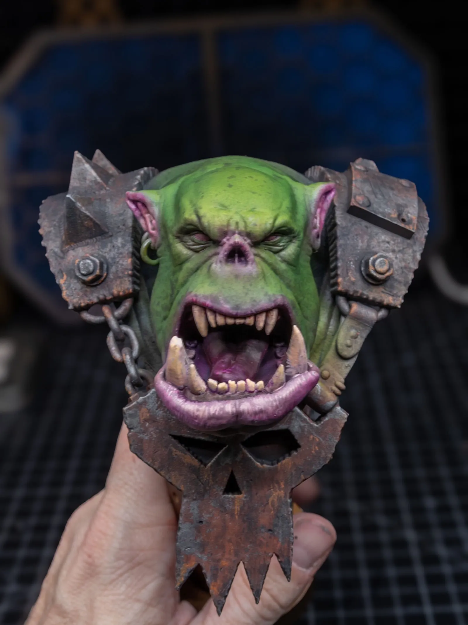 Ork bust color stage, showing purple shadow tones in lips and recesses
